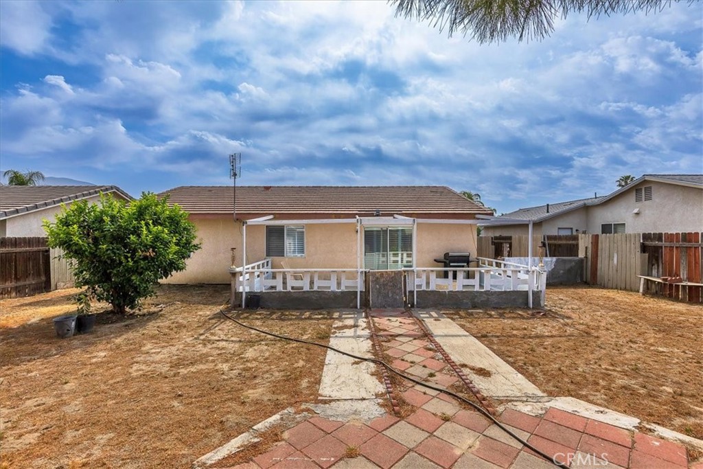 162 Peppertree Way San Jacinto, CA 92583 - Photo 16 of 23 a front view of a house with a yard and garage