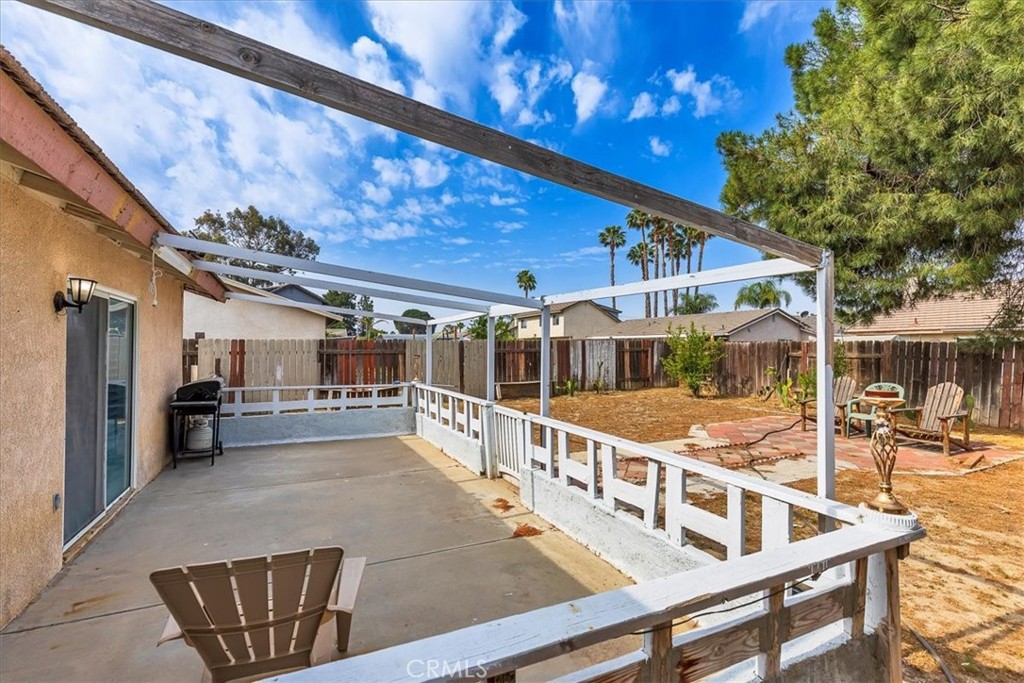 162 Peppertree Way San Jacinto, CA 92583 - Photo 21 of 23 a view of a patio with a table and chairs