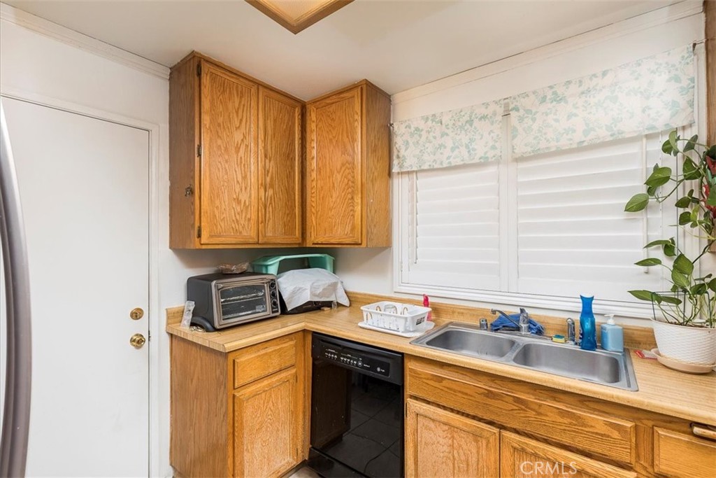 162 Peppertree Way San Jacinto, CA 92583 - Photo 6 of 23 a kitchen with stainless steel appliances granite countertop sink stove and cabinets