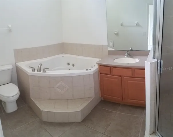 a white bath tub sitting in a bathroom