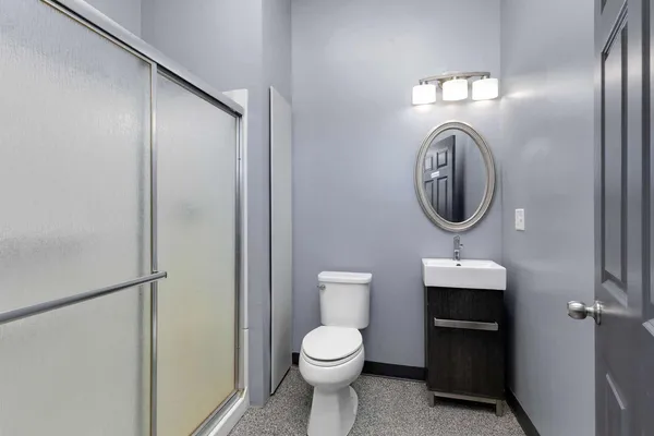 a bathroom with a toilet and a sink