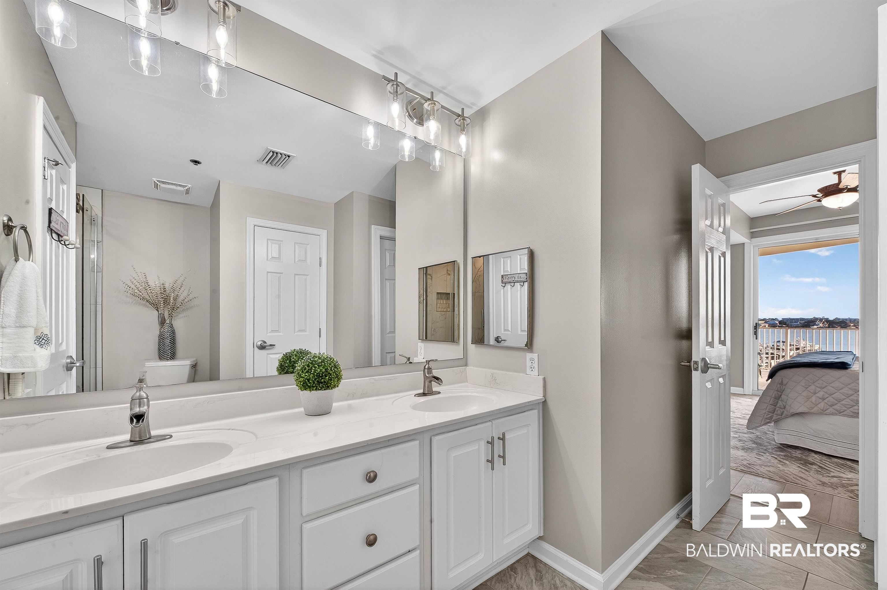 27282 Canal Road, Unit 408 Orange Beach, AL 36561 - Photo 13 of 37 Ensuite bathroom with double vanity and a ceiling fan