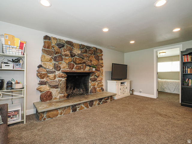2444 Quail Run Drive Sandy, UT 84093 - Photo 12 of 23 Rock Fireplace lower level family room