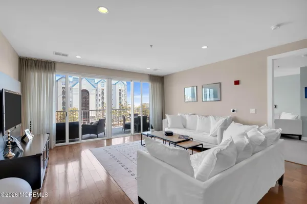 a bathroom with a granite countertop sink mirror and shower
