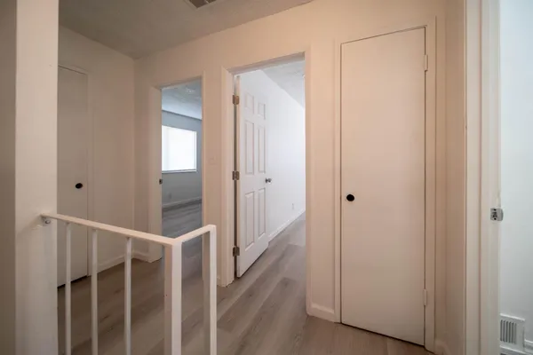a view of entryway with wooden floor