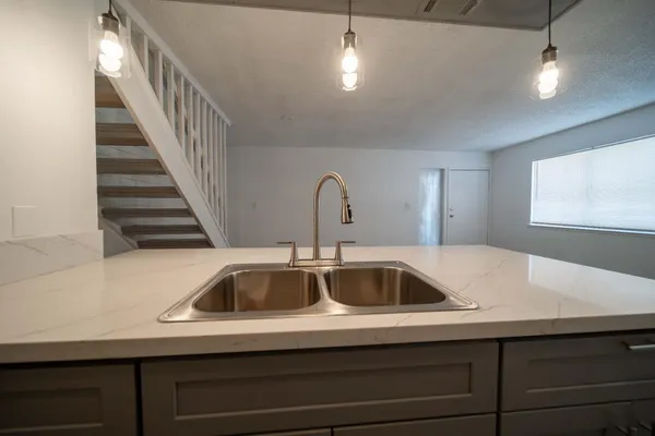 a kitchen with a sink and a window