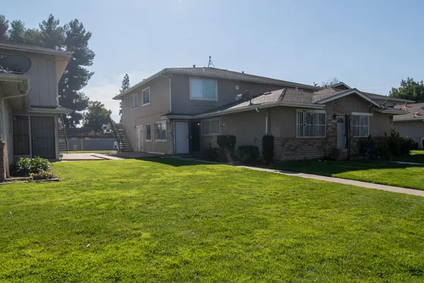 a front view of a house with a yard