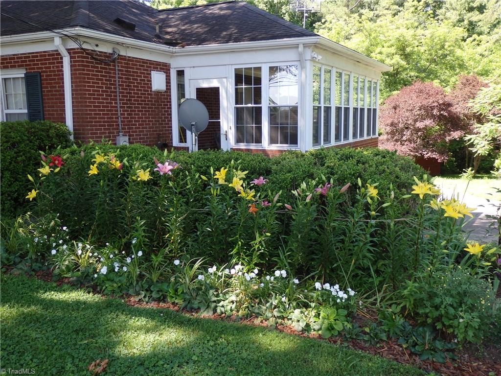 206 Coleridge Road Ramseur, NC 27316 - Photo 3 of 30 flower bed on right side of home