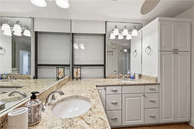 a bedroom with a large bed and a large window