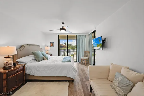 a view of a balcony with furniture and city view