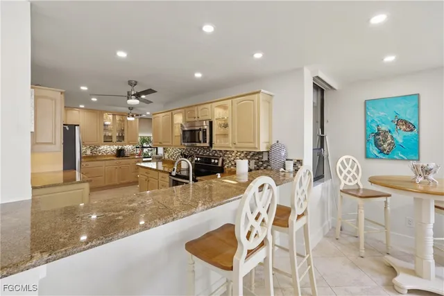 a view of a patio with dining table and chairs
