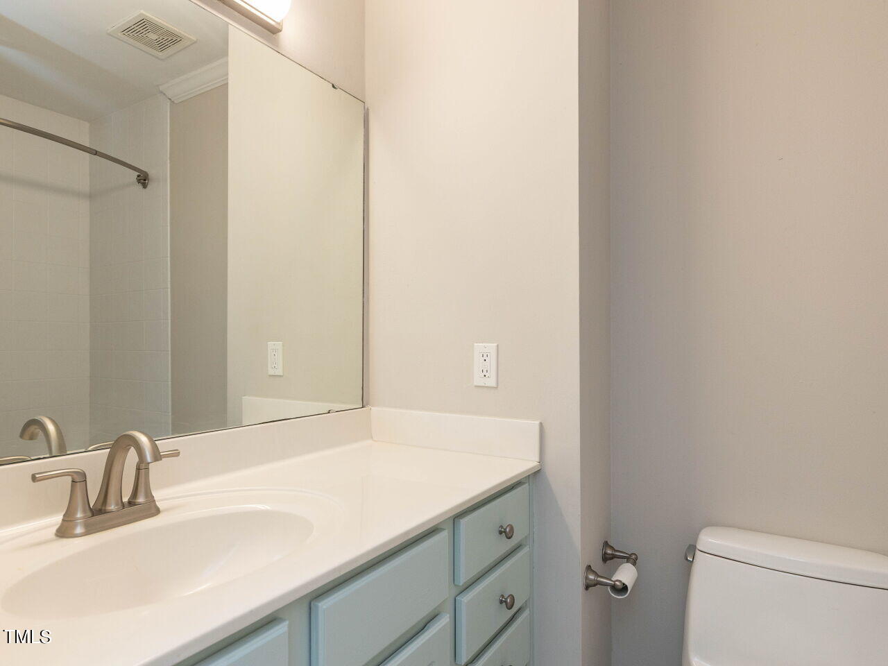 7833 Falcon Rest Circle Raleigh, NC 27615 - Photo 21 of 26 a bathroom with a sink and a mirror