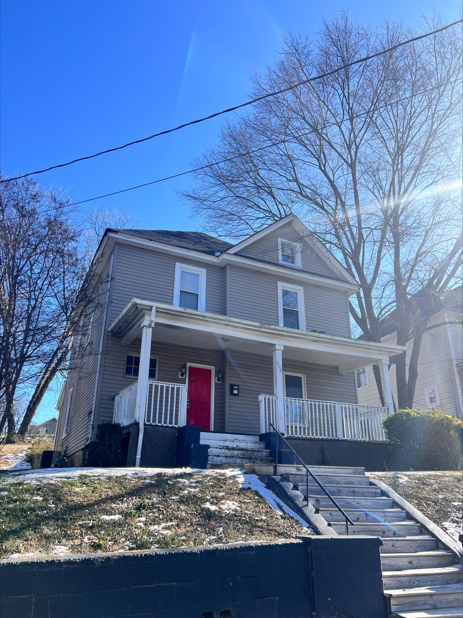 a view of a house with a large tree