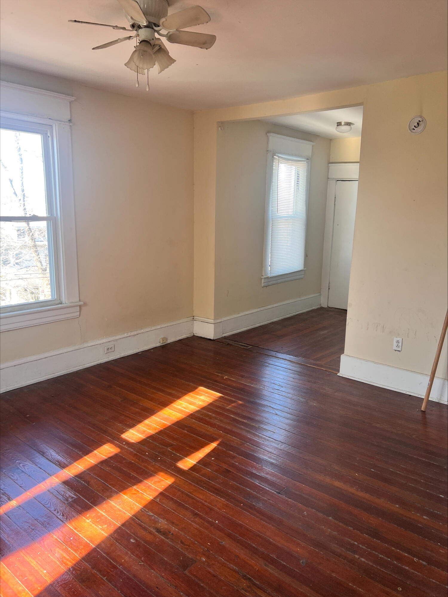906 5th Street Southeast Roanoke, VA 24013 - Photo 3 of 11 an empty room with wooden floor and windows