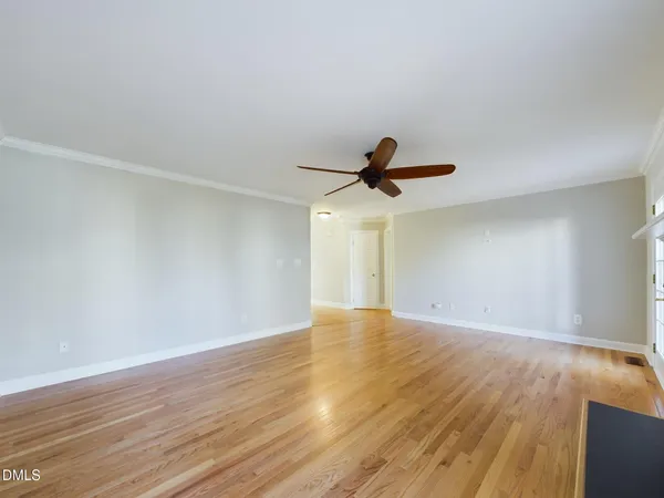 a kitchen with stainless steel appliances and white cabinets