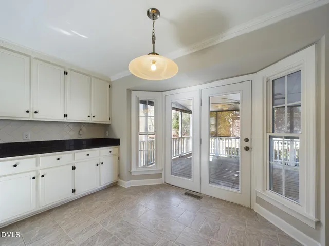 a kitchen with stainless steel appliances a stove refrigerator sink and cabinets