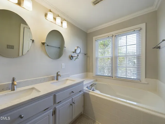 a view of a livingroom with a ceiling fan and window