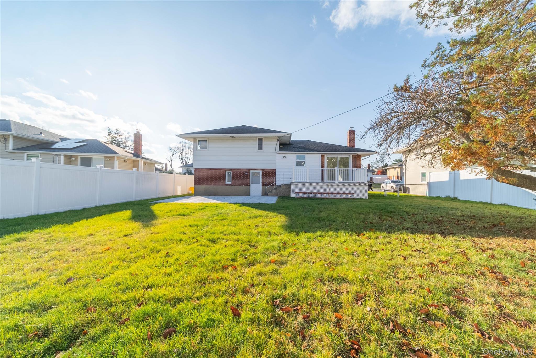 8 Spector Lane Plainview, NY 11803 - Photo 15 of 15 a view of a house with a yard