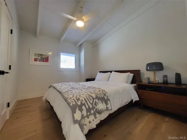 a bedroom with bed and window