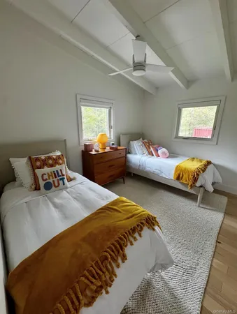 a bedroom with bed and window