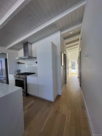 a view of a kitchen from the hallway