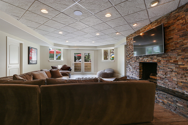 218 Shadow Ridge Court Palos Park, IL 60464 - Photo 31 of 40 a living room with furniture a fireplace and a flat screen tv