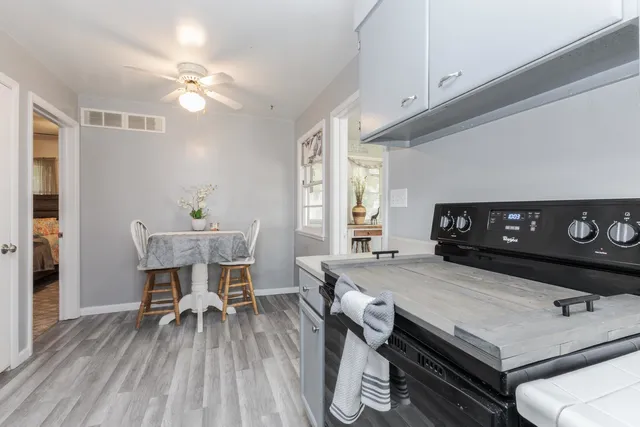 a view of a dining room with furniture and wooden floor