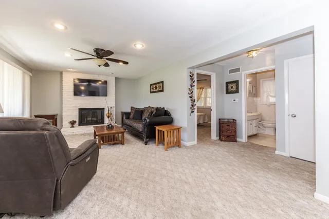 a living room with furniture and a fireplace