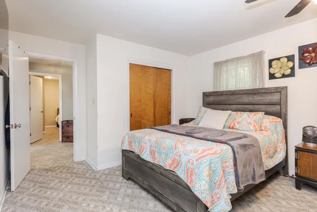 a bedroom with a bed and a view of bathroom