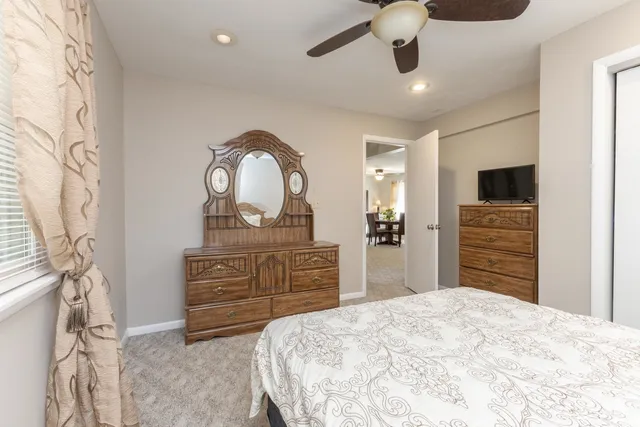 a bedroom with a bed and a television