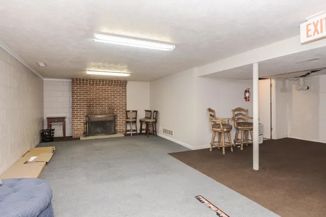a view of a livingroom with furniture and a chair