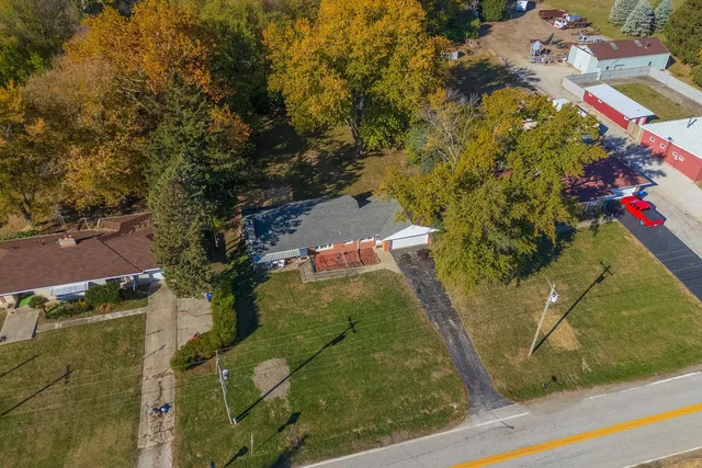 an aerial view of residential houses with outdoor space