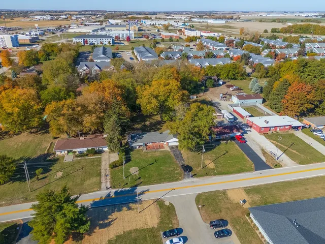 an aerial view of residential houses with outdoor space