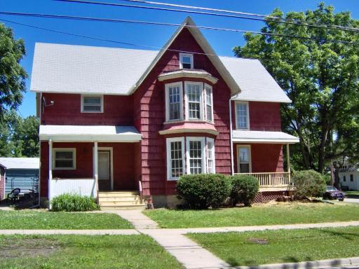 486 Ashland Avenue Elgin, IL 60123 - Photo 1 of 21 a front view of a house with a yard
