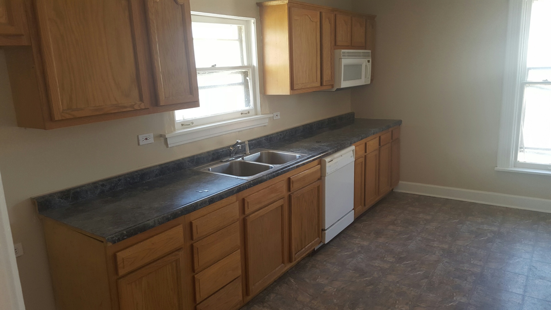 486 Ashland Avenue Elgin, IL 60123 - Photo 11 of 21 a kitchen that has a sink and a stove