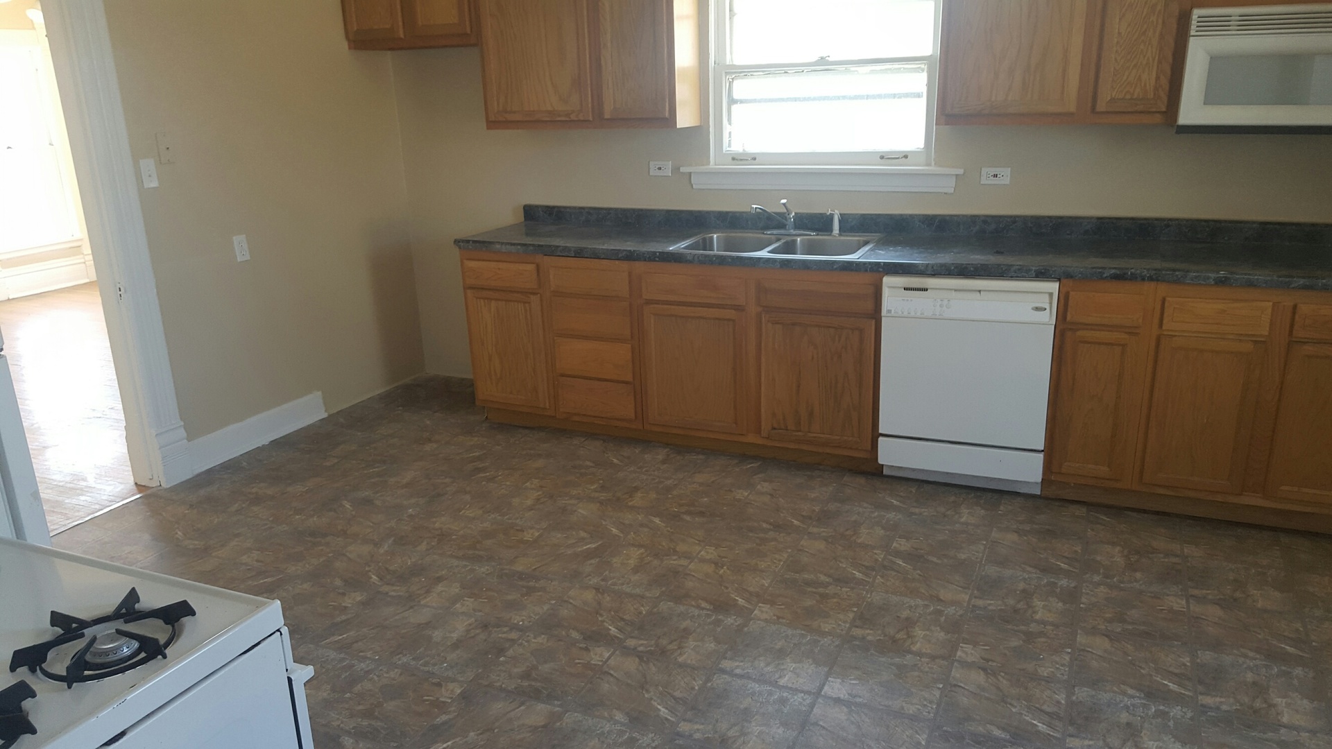 486 Ashland Avenue Elgin, IL 60123 - Photo 12 of 21 a kitchen with granite countertop a sink stove and cabinets