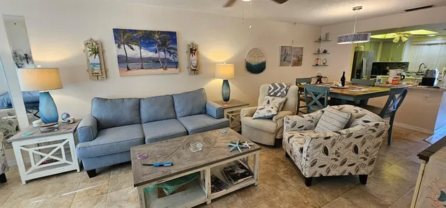a living room with furniture and a lamp