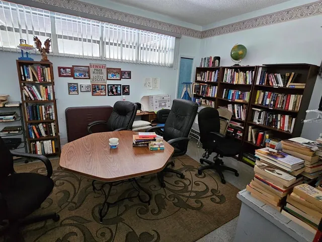 a workspace with furniture book shelves