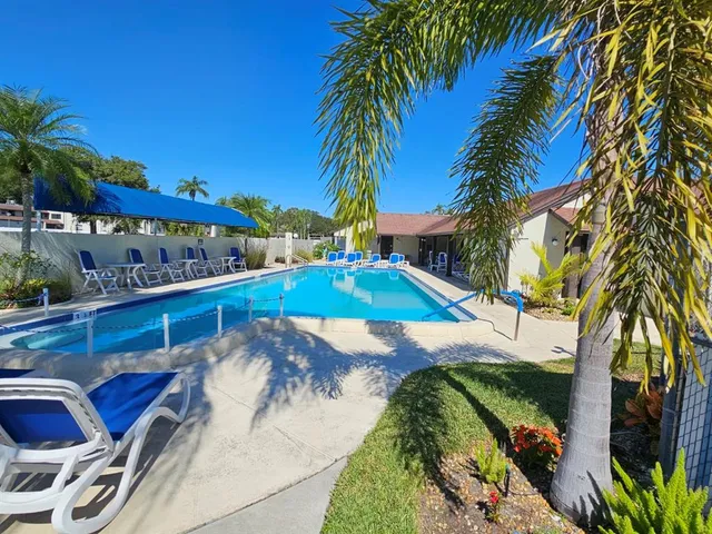 a view of swimming pool with outdoor seating