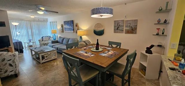 a living room with furniture and a table