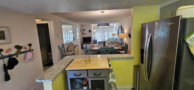 a view of living room with furniture and a window