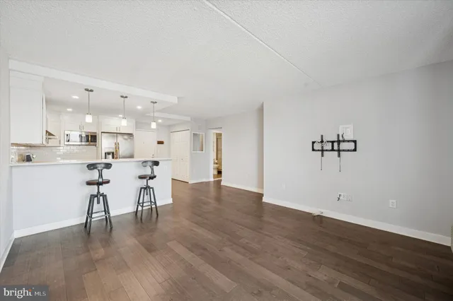 a view of a kitchen and dining room