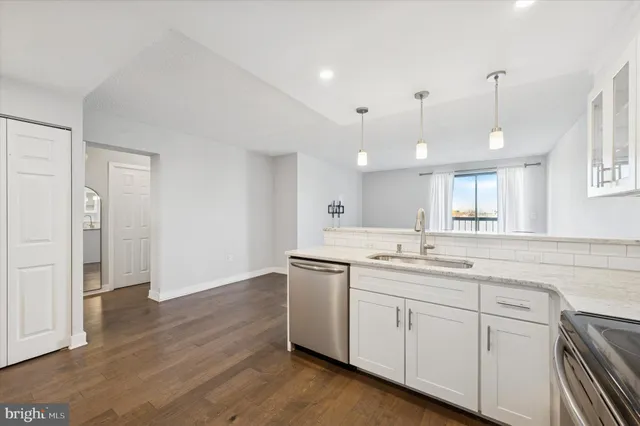 a kitchen with a sink and cabinets