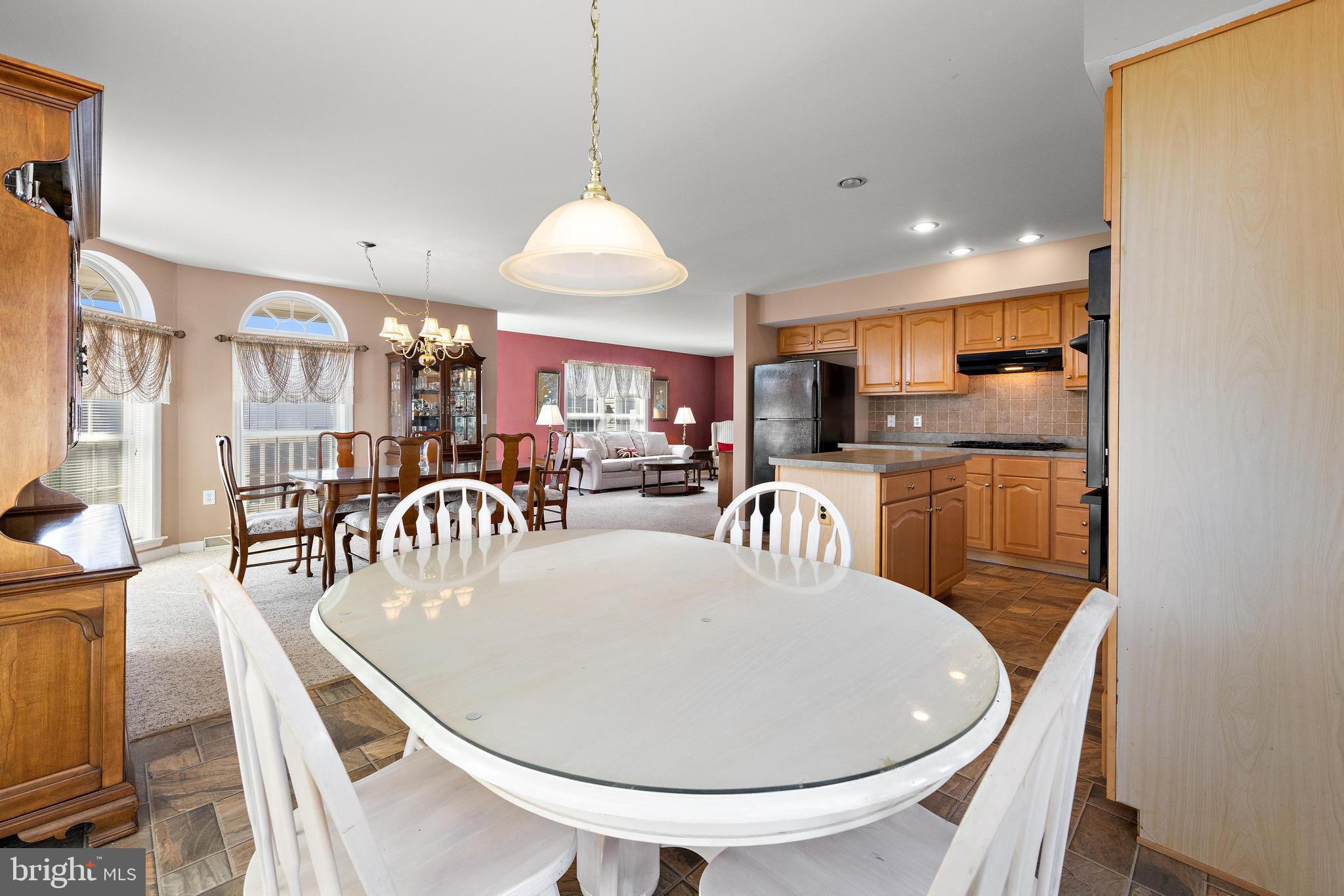 75 Oak Ridge Lane Manahawkin, NJ 08050 - Photo 16 of 50 a view of a dining room with furniture