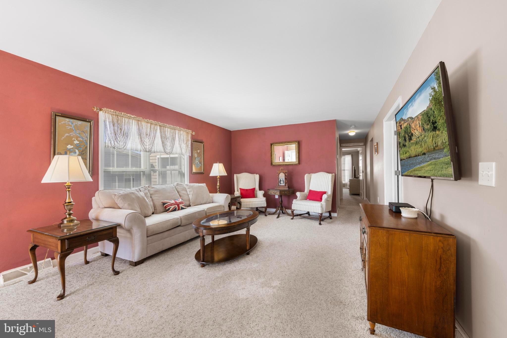 75 Oak Ridge Lane Manahawkin, NJ 08050 - Photo 17 of 50 a living room with furniture and a flat screen tv