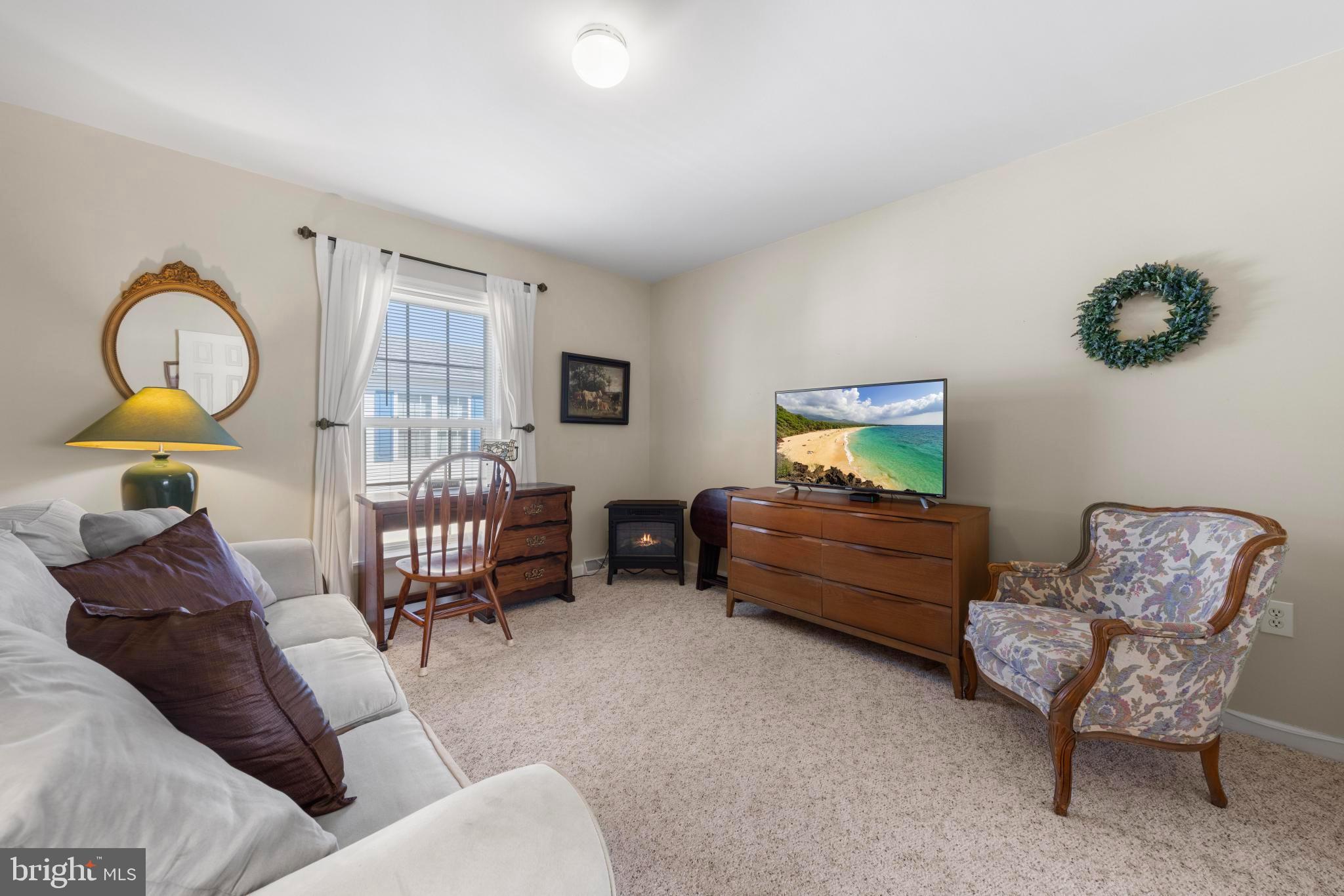 75 Oak Ridge Lane Manahawkin, NJ 08050 - Photo 20 of 50 a living room with furniture and a window