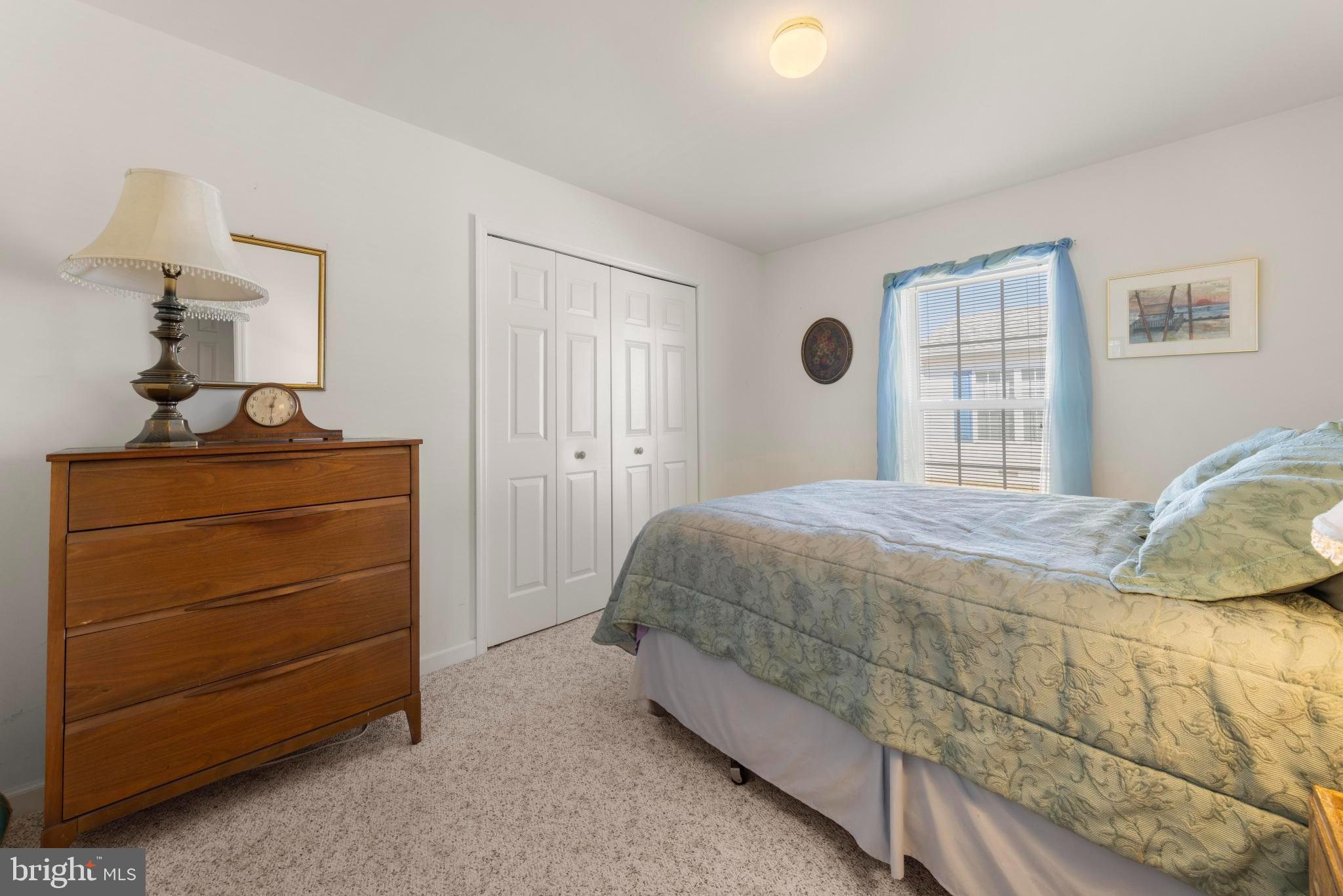 75 Oak Ridge Lane Manahawkin, NJ 08050 - Photo 22 of 50 a bedroom with a bed and a dresser