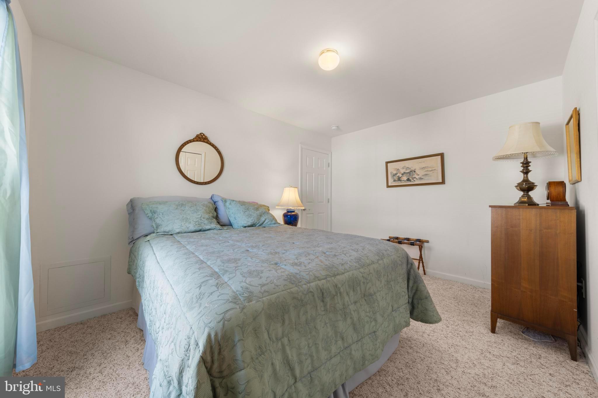 75 Oak Ridge Lane Manahawkin, NJ 08050 - Photo 23 of 50 a bedroom with a bed and a dresser