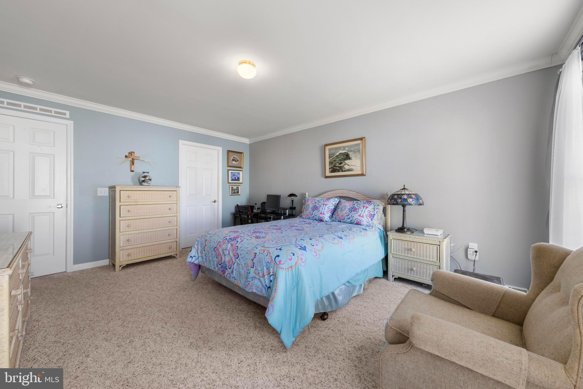 75 Oak Ridge Lane Manahawkin, NJ 08050 - Photo 26 of 50 a spacious bedroom with a bed and a couch