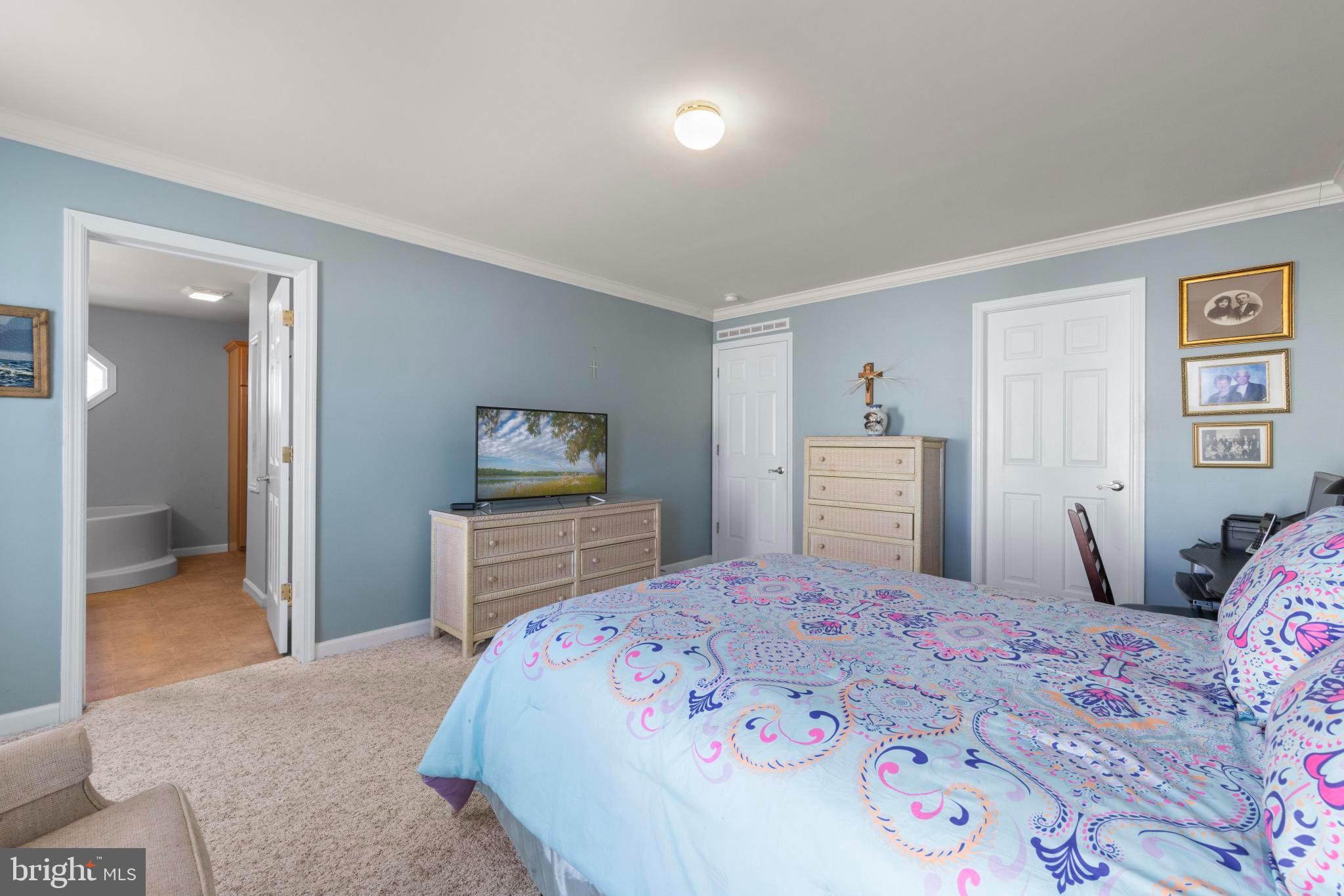 75 Oak Ridge Lane Manahawkin, NJ 08050 - Photo 27 of 50 a bedroom with a bed and a dresser in it